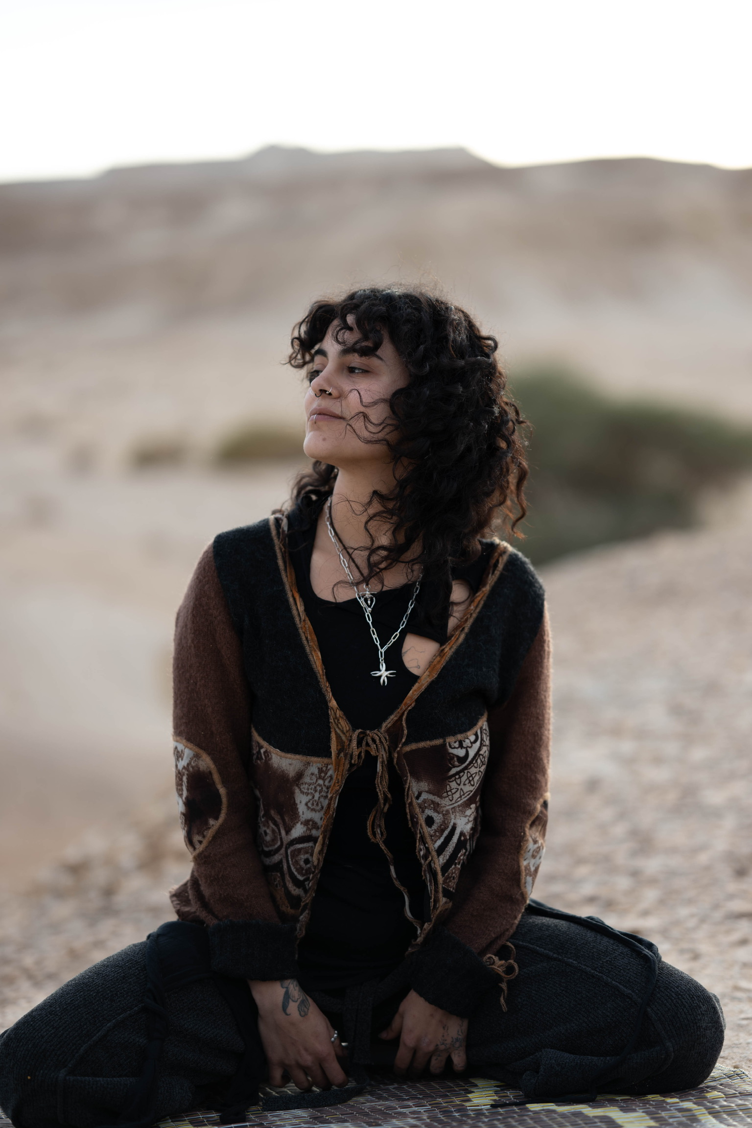 The maker, in the desert, wearing her own silver