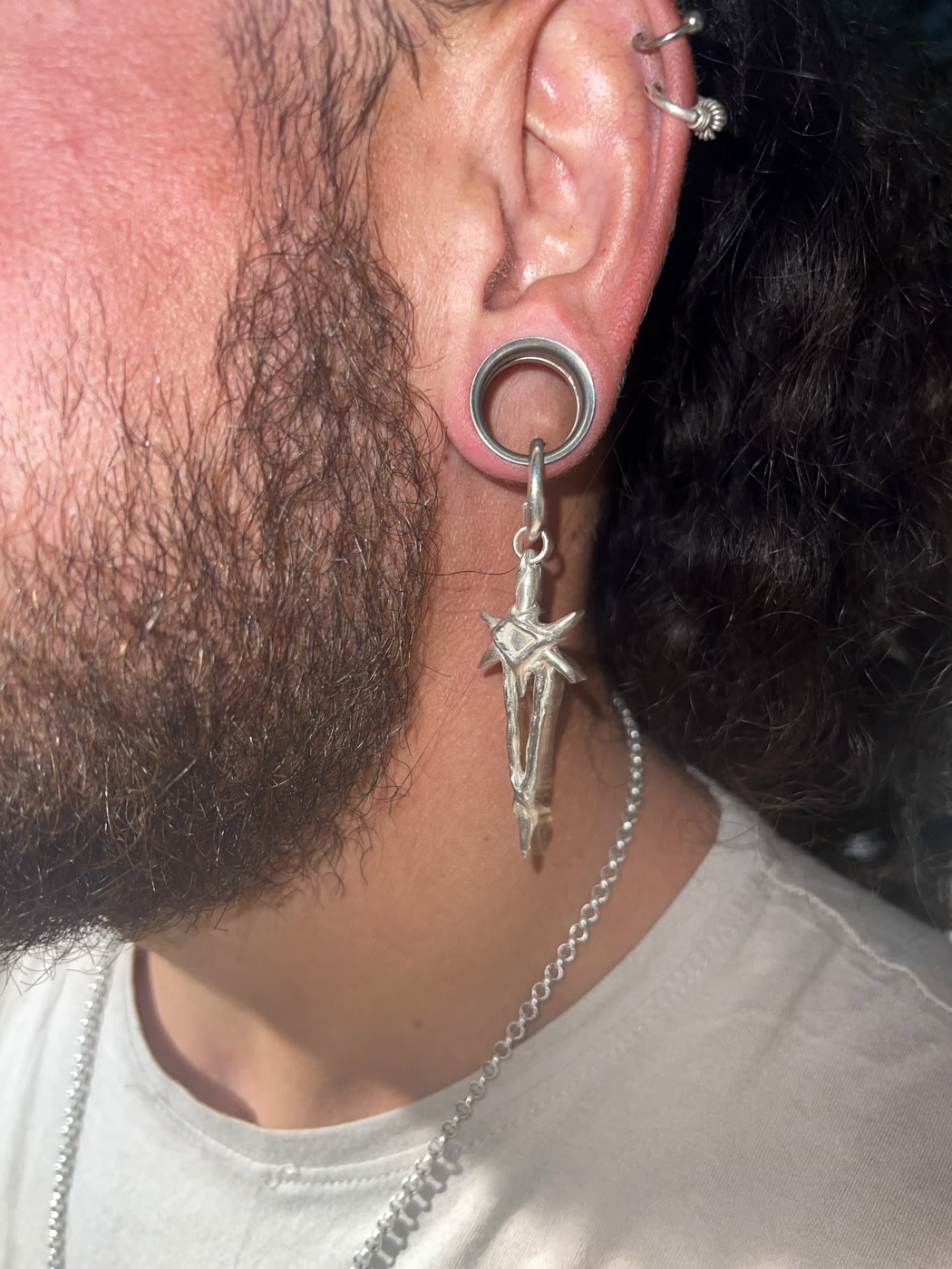 Commissioned silver earring, worn